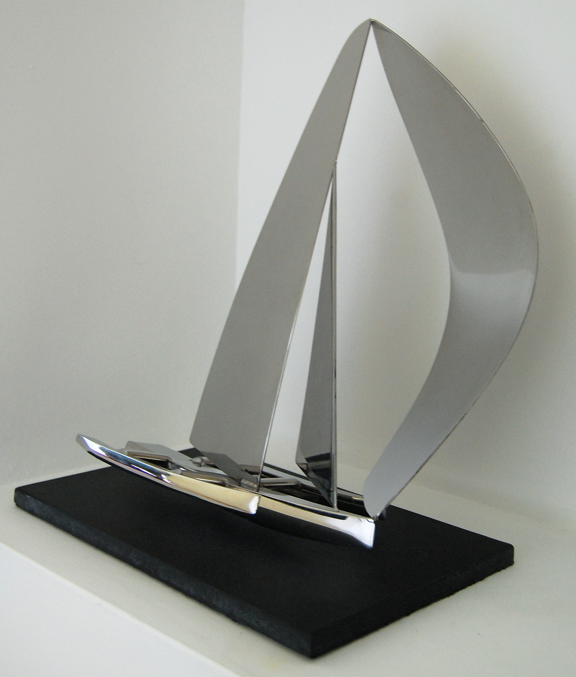 This Trimaran sculpture is handmade in stainless steel and mounted on a slate base. POA